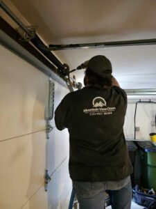 Springs Repairman Fixing Garage Doors Springs