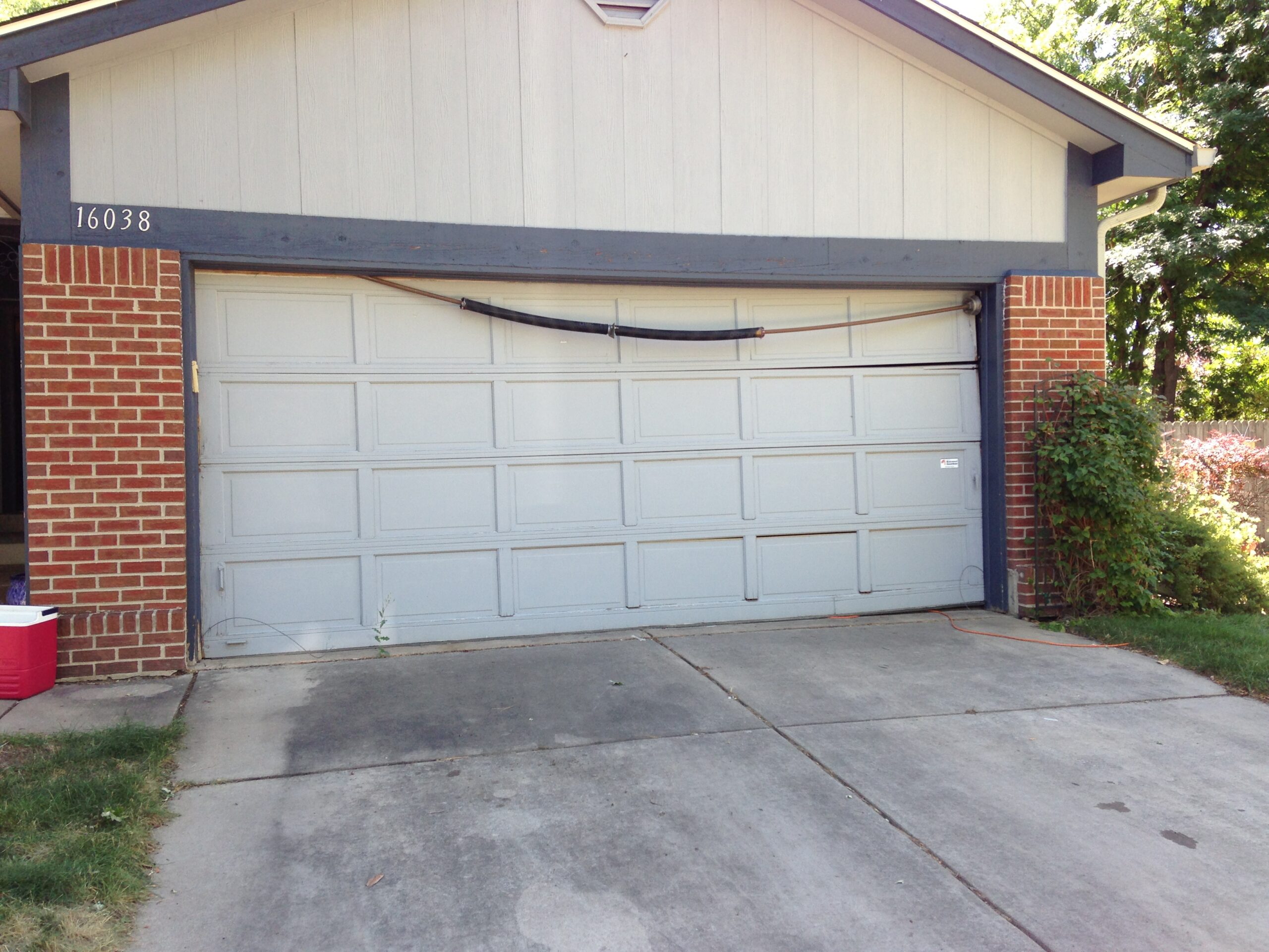 Before: OId damaged garage door