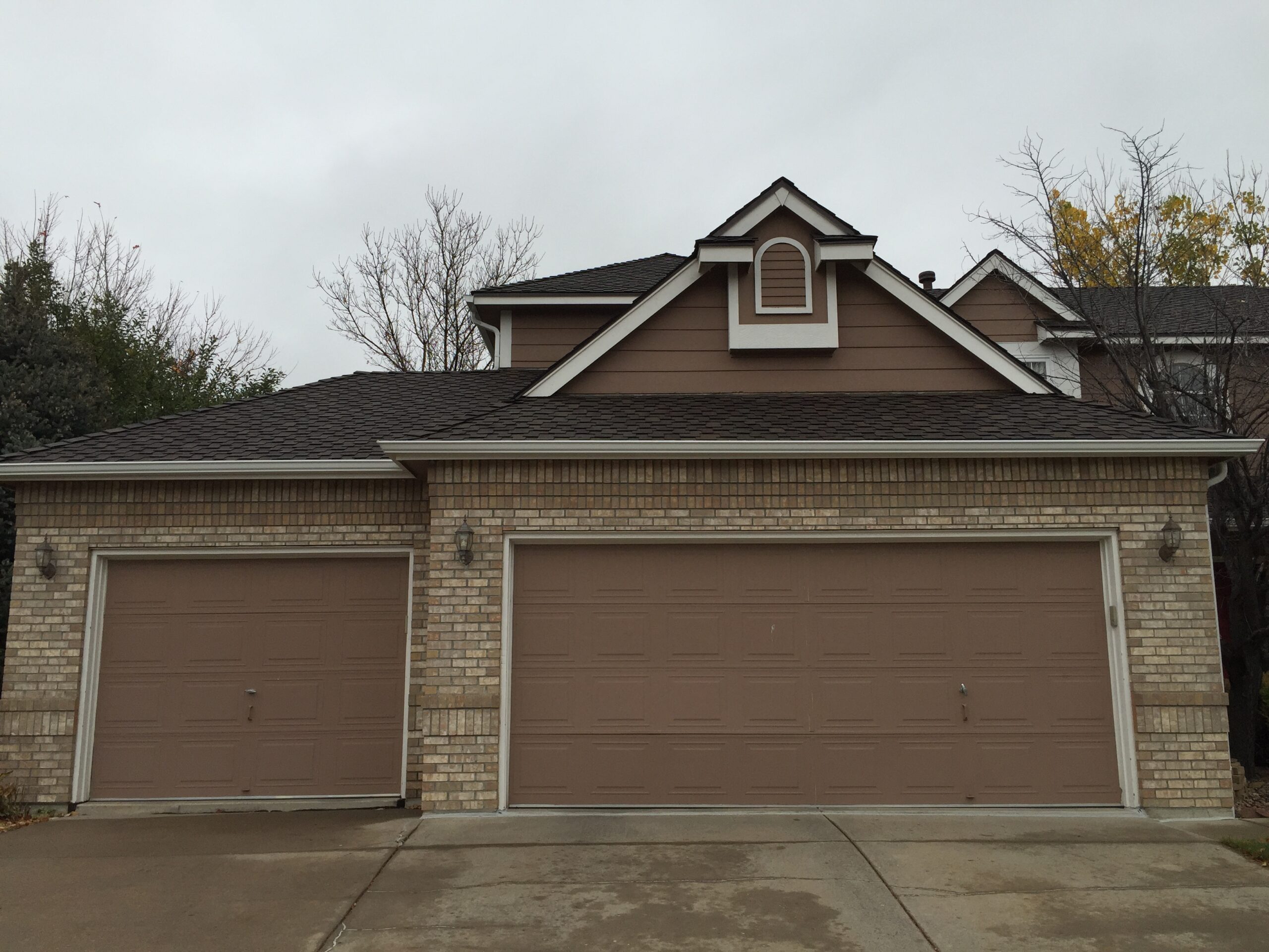 Before: Old damaged garage doors